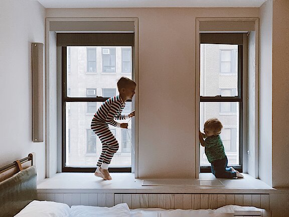 two-kids-playing-beside-glass-windows-3273851.jpg  