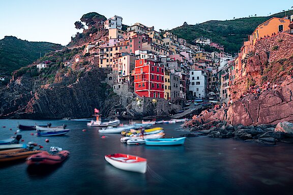 white-and-red-boat-on-water-near-brown-concrete-buildings-3711348.jpg